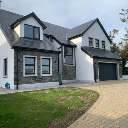 Modern house with Silver Granite Window and Garage Surrounds and Plinths.