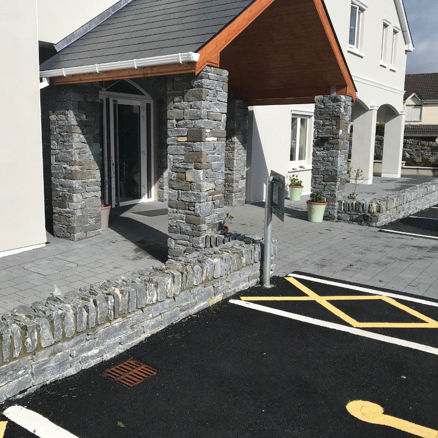 Nursing home entrance with low walls completed in Silver Shale Machined walling stone.