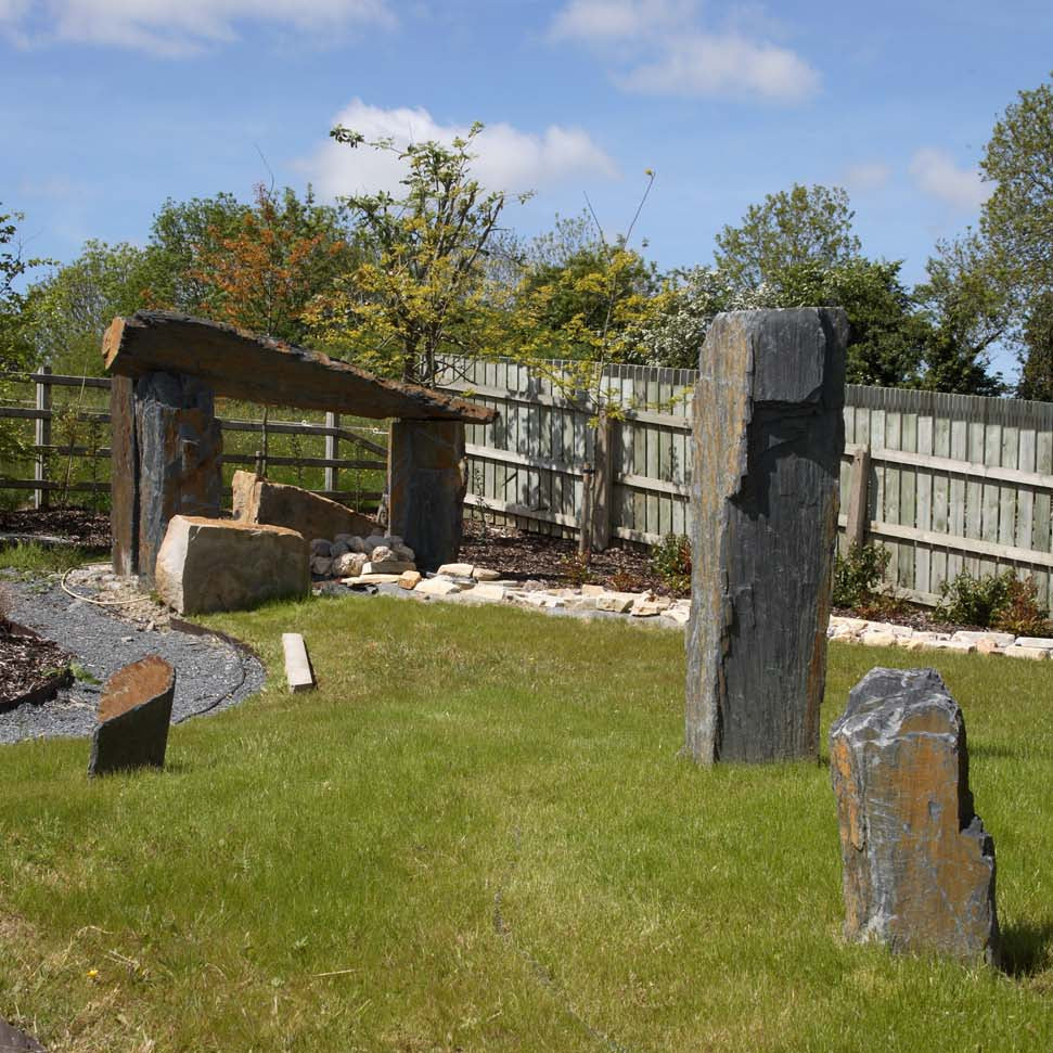 Garden design featuring slate monoliths of various sizes. 