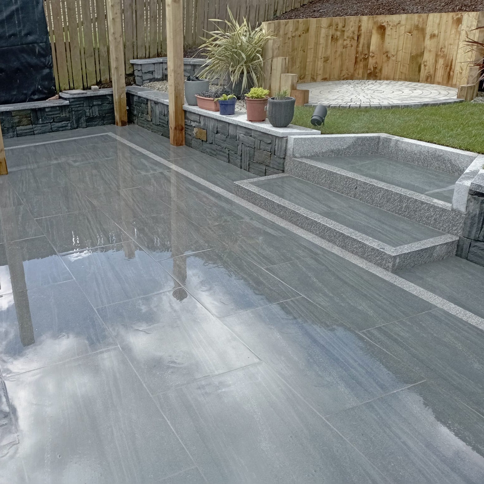 Patio area featuring Smokey Jewel Range Porcelain Paving. 