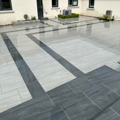 Patio area completed with two porcelain paving tiles. The darker design is Smokey Jewel Range Porcelain Paving. 