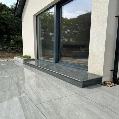 Patio step completed using Smokey Jewel Range Porcelain Paving. 