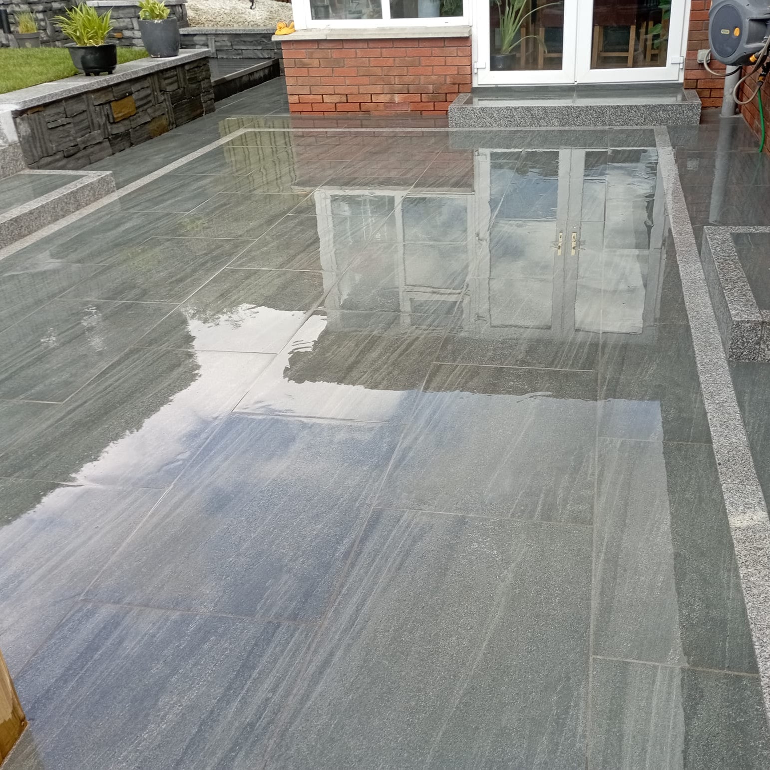A porcelain tiled patio finished using 
Smokey Jewel Range Porcelain Paving Tiles. 