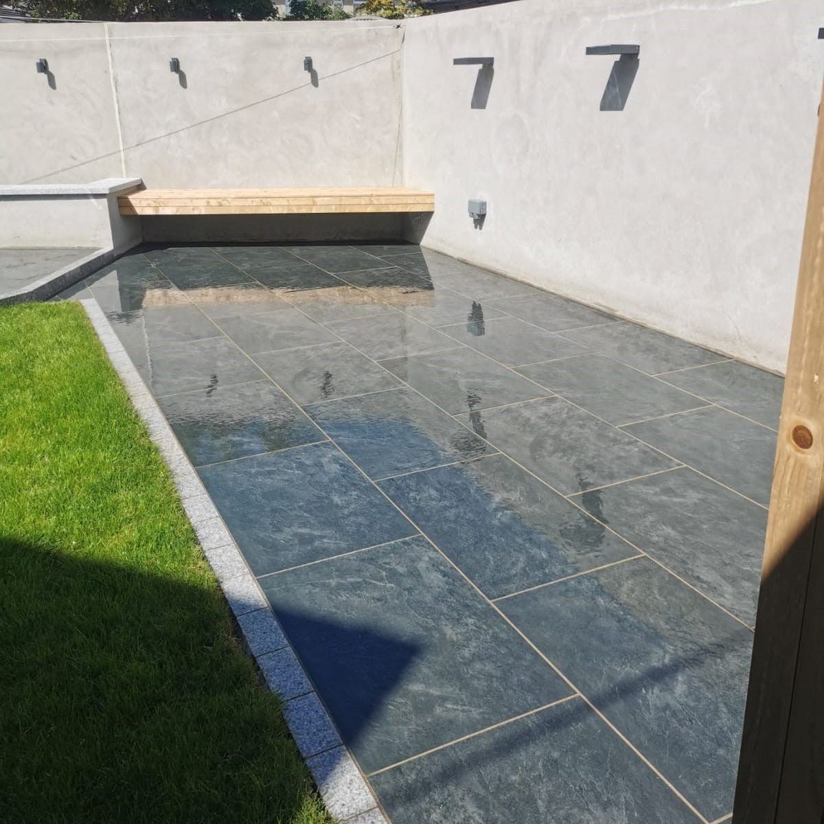 Another angle of this beautiful patio area featuring Station Black Porcelain Paving Tiles. 