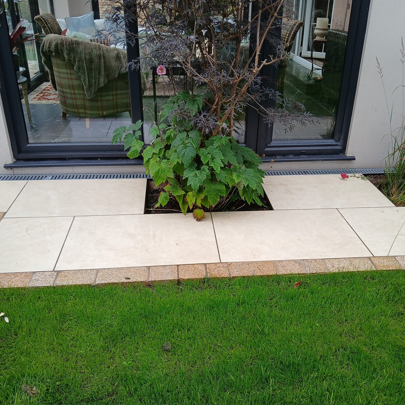 Pathway completed using Station White porcelain paving tiles in a garden setting. 