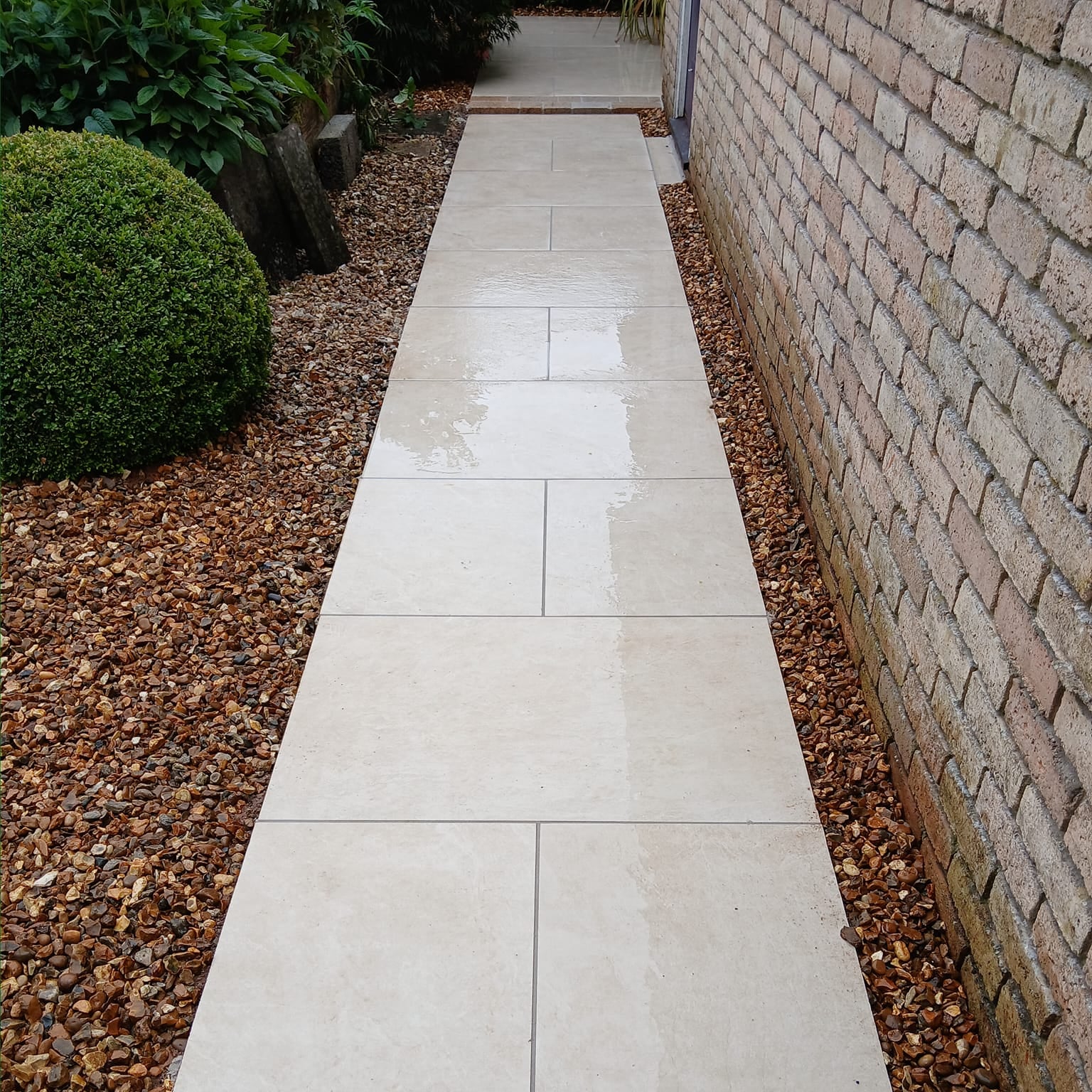 Pathway featuring Station White Outdoor Porcelain Tiles. 