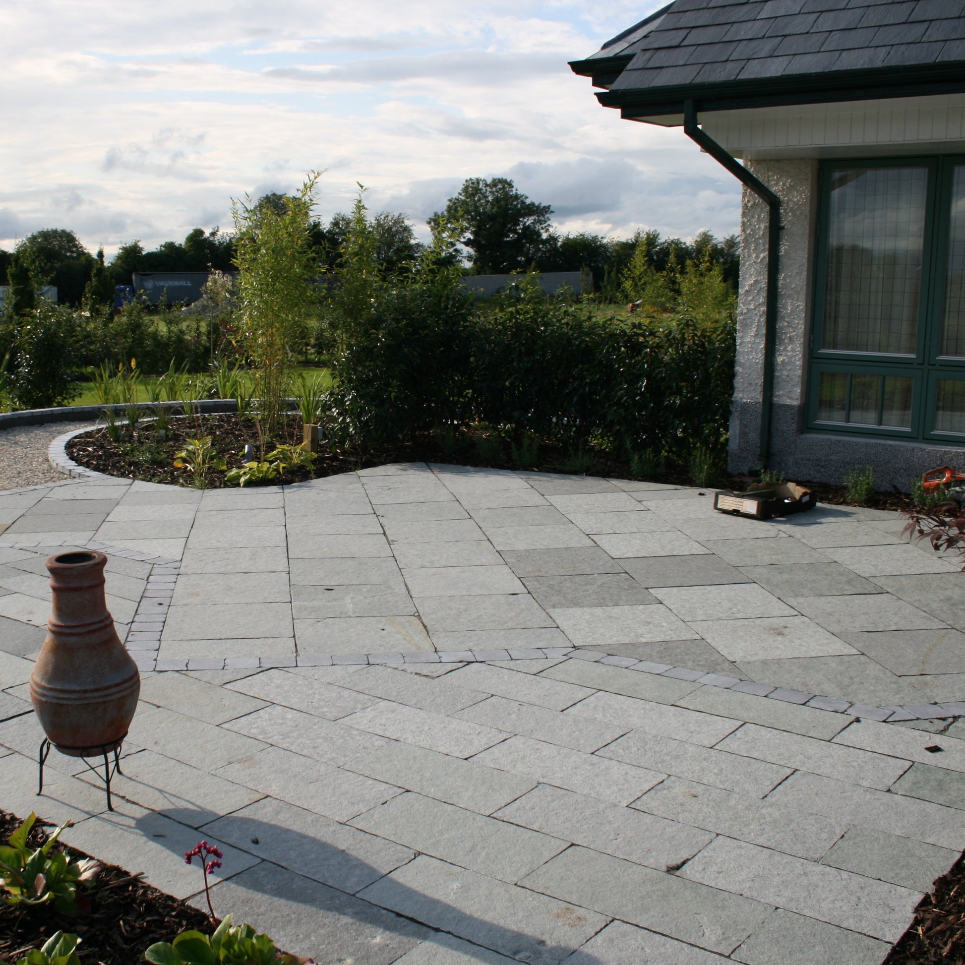 Patio area featuring T-Grey Limestone Paving in patio pack mixed sizes. 