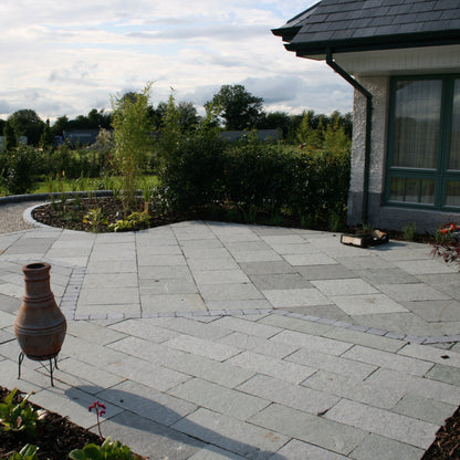 Patio area featuring T-Grey Limestone Paving in patio pack mixed sizes. 