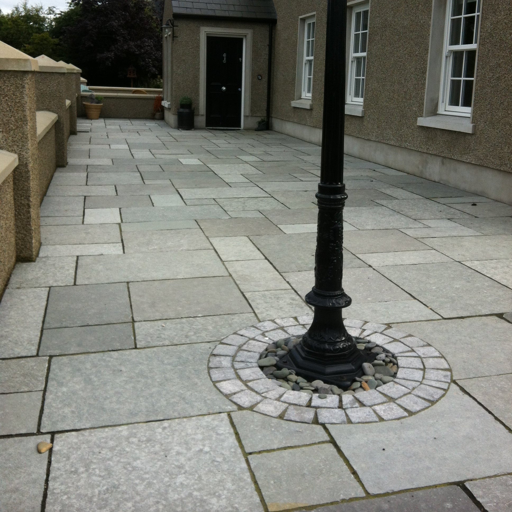 Patio area leading to house entrance completed using T-Grey Limestone Paving in mixed patio pack sizes. 