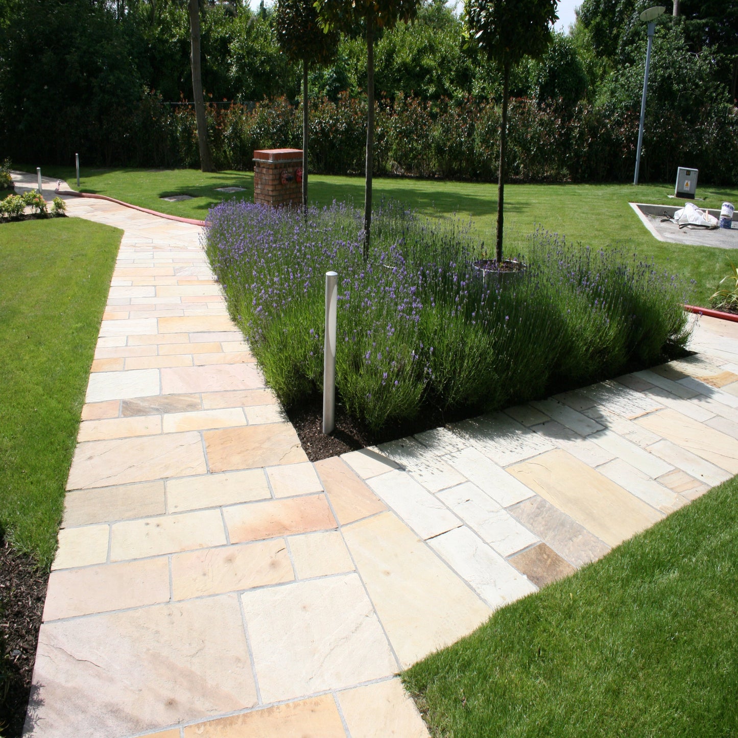 Tinted Mint Sandstone Paving installed as a pathway