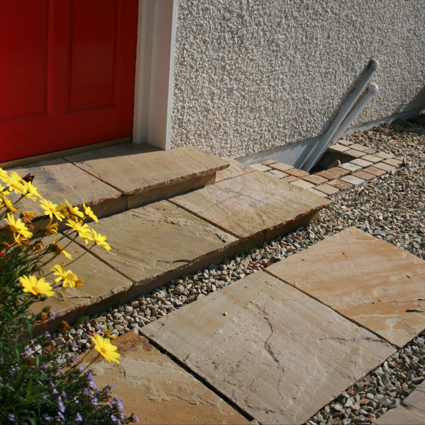 Steps completed using Tinted Mint Sandstone Paving in 600 x 600mm size. 