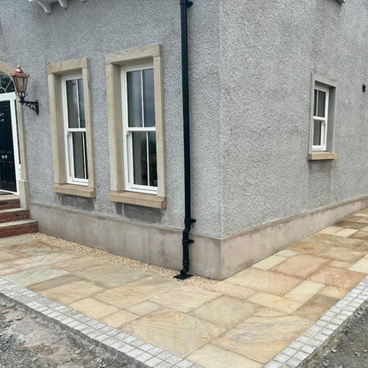 Path featuring Tinted Mint Sandstone paving in mixed sizes. 
