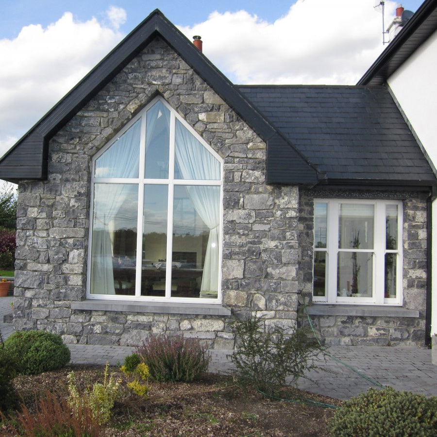 Stone porch in white limestone machined building stone and limestone sills. 