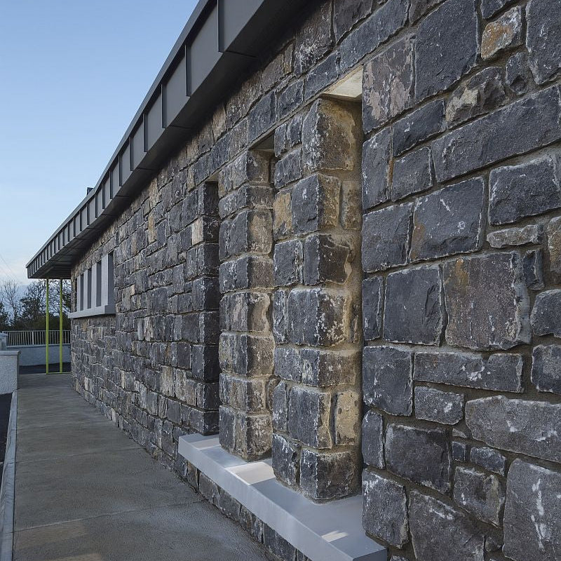 Commercial building in white limestone machined walling stone. 