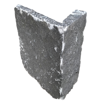 An L-shaped white limestone stone corner piece with a rough texture.