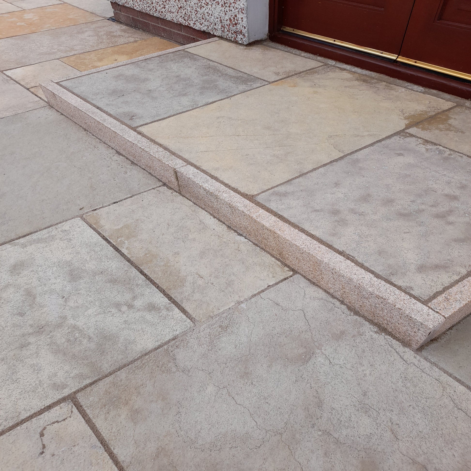 Close up of step featuring Yellow Limestone Machined Paving in mixed patio pack sizes. 