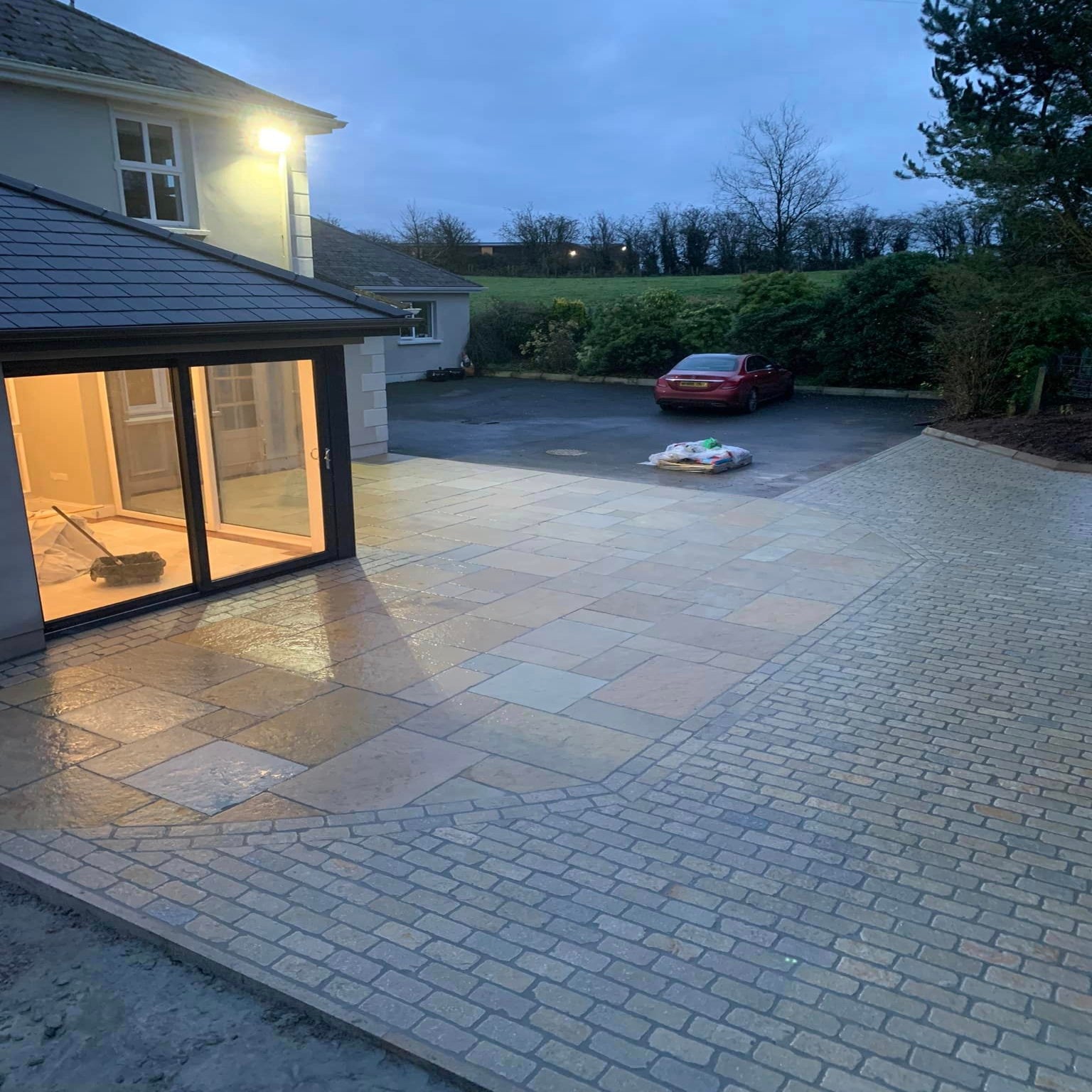 Patio area showcasing a design completed with Yellow Limestone Paving Cobbles in 200 x 100mm size. 