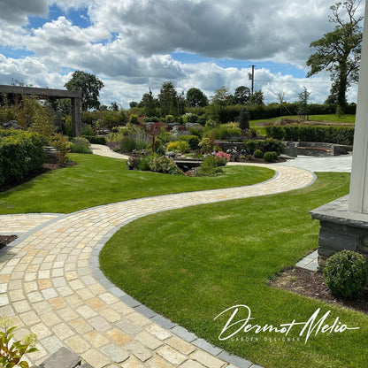 Beautiful garden pathway featuring Tumbled Yellow Limestone Paving Cobbles in 200 x 100mm size. 