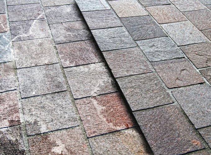 Natural stone paving stained with Efflorescence 